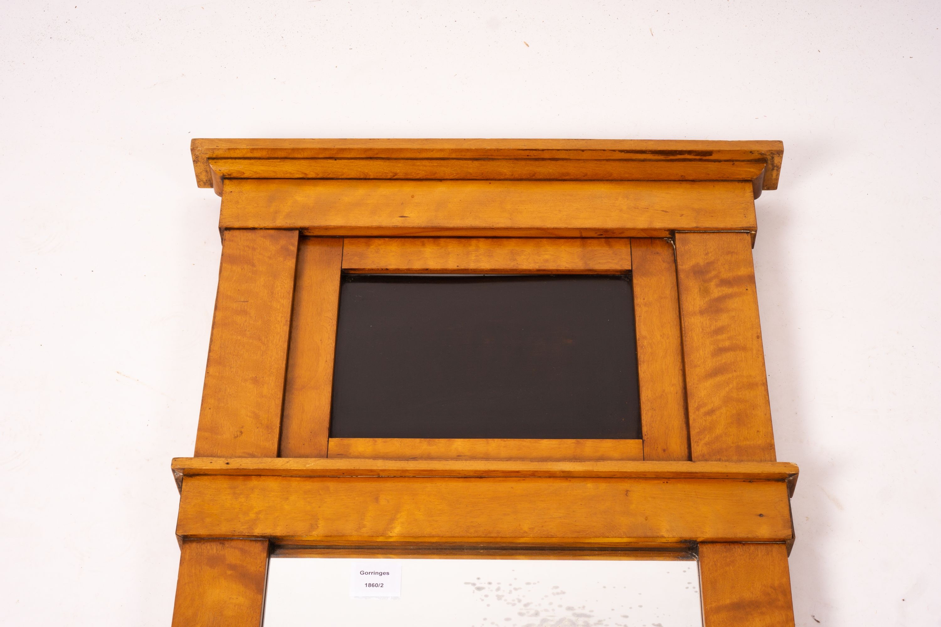 A Biedermeier style maple wall mirror, width 52cm, height 109cm